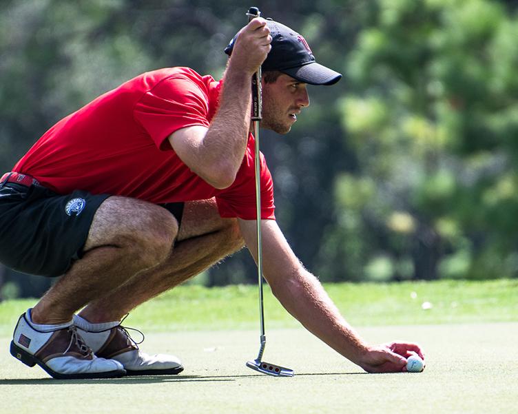 Student playing golf